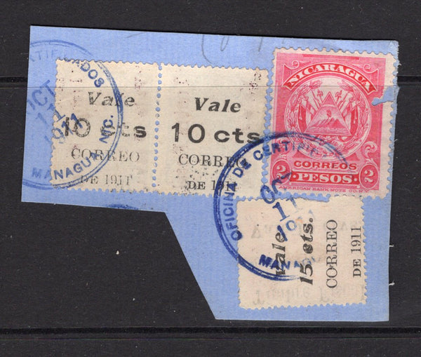 NICARAGUA - 1911 - RAILWAY COUPON ISSUE: 10c on 5c on 2c blue pair and 15c on 10c on 1c vermilion 'Railway Coupon' issue on piece with 1909 2p carmine 'Arms' issue all tied by two strikes of MANAGUA cds dated OCT 11 1911. (SG 321, 322 & 289)  (NIC/17205)