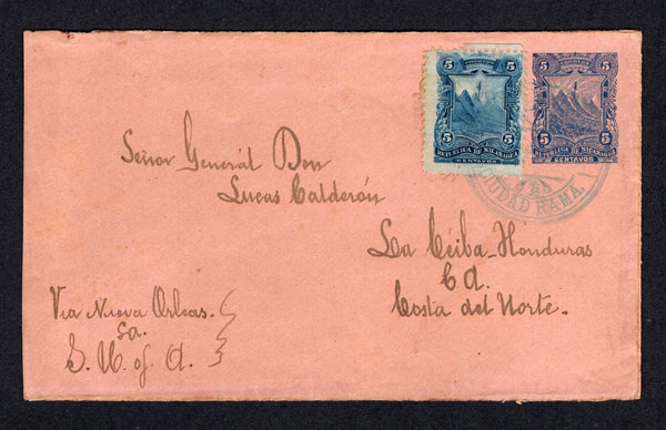 NICARAGUA - ZELAYA - 1894 - CANCELLATION: 5c dark blue on salmon 'Seebeck' postal stationery envelope (H&G B19) used with added 1893 5c blue (SG 59) tied by fine strike of CIUDAD RAMA cds in blue. Addressed to USA with BLUEFIELDS transit cds and USA arrival mark on reverse. Scarce origination.  (NIC/23758)