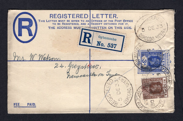 NIGERIA - 1933 - POSTAL STATIONERY & CANCELLATION: 3d blue GV postal stationery registered envelope (H&G C3) used with added 1921 2d chocolate GV issue (SG 20) tied by OGBOMOSHO cds's with printed blue & white 'Ogbomosho' registration label alongside. Addressed to UK with oval REGISTERED OSHOGBO and LAGOS transit marks on front & reverse.  (NIG/21812)