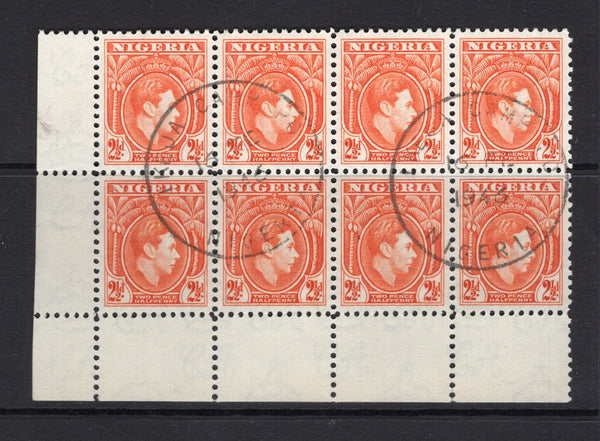 NIGERIA - 1938 - CANCELLATION & MULTIPLE: 2½d orange GVI issue, a superb used corner marginal block of eight with two strikes of IKEJA CAMP P.O. skeleton cds dated 16 FEB 1946. (SG 52b)  (NIG/32702)