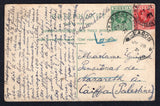 NIGERIA - 1921 - CANCELLATION & DESTINATION: Colour PPC of Rotterdam, Netherlands franked on message side with 1921 ½d green and 1d rose carmine GV issue (SG 15/16) tied by BADAGRY cds's dated 27 JUL 1921. Addressed to NAZARETH, PALESTINE with LAGOS transit cds and part boxed Arabic arrival mark in blue on front.  (NIG/37787)