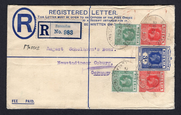 NIGERIA - 1931 - POSTAL STATIONERY & REGISTRATION: 3d blue GV postal stationery registered envelope (H&G C2) used with added 1921 2 x ½d green and 2 x 1d rose carmine GV issue (SG 15/16) tied by multiple strikes of oval REGISTRATION FORCADOS cancels dated 29 DEC 1931 with printed blue on white 'Forcados' registration label alongside. Addressed to GERMANY with LAGOS transit mark on reverse.  (NIG/39791)