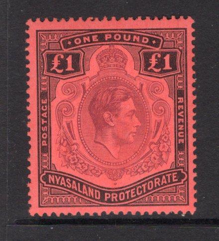 NYASALAND - 1938 - GVI ISSUE: £1 purple & black on red GVI issue, a fine mint copy. (SG 143)  (NYA/15005)