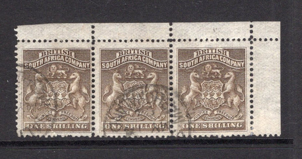 RHODESIA - 1892 - MULTIPLE: 1/- grey brown 'Arms' issue, a fine cds used corner marginal strip of three. (SG 4)  (RHO/15477)