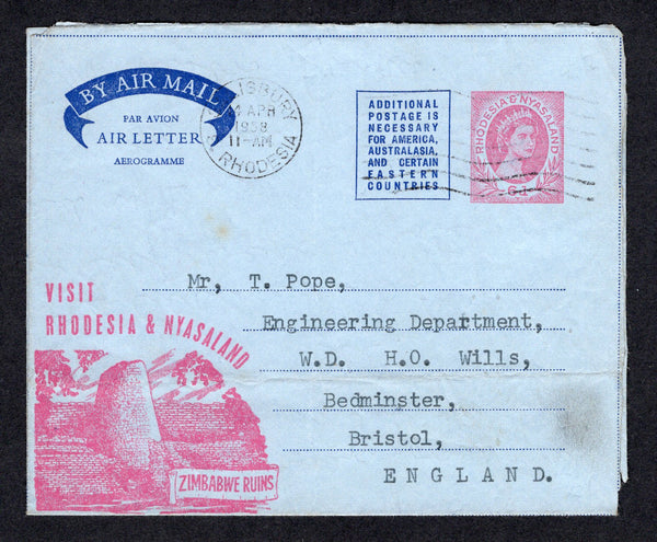 RHODESIA - RHODESIA & NYASALAND - 1957 - POSTAL STATIONERY: 6d pink on light blue QE2 postal stationery airletter (H&G FG3) with view 'Zimbabwe Ruins' used with SALISBURY machine cancel. Addressed to UK.  (RHO/22150)
