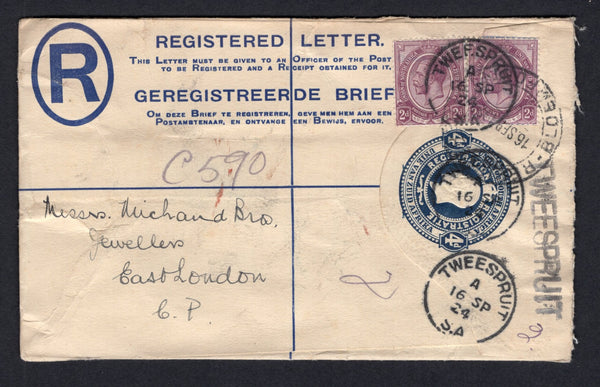 SOUTH AFRICA - 1924 - POSTAL STATIONERY, REGISTRATION & CANCELLATION: 4d deep blue on cream GV postal stationery registered envelope (H&G C2a) used with added pair 1913 2d dull purple 'GV Head' issue (SG 6) tied by multiple strikes of TWEESPRUIT cds dated 16 SEP 1924 with straight line 'TWEESPRUIT' registration handstamp at right with manuscript '2' registration number added. Addressed to EAST LONDON with BLOEMFONTEIN transit cds on front.  (SAF/38746)