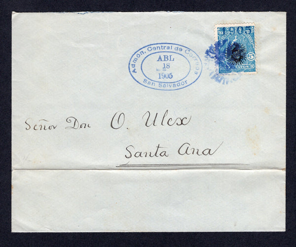 SALVADOR - 1905 - PROVISIONAL ISSUE & SCHOOL TAX: Cover franked with 1905 5c blue 'Ceres' issue with 'Shield' opt in black and '1905' opt in blue (SG 544) tied by dumb 'Cork' cancel with oval ADMON CENTRAL DE CORREOS SAN SALVADOR cancel dated APR 18 1905 both in blue. Addressed to SANTA ANA with 1904 1c black 'Timbre de Instruccion Primaria' SCHOOL TAX stamp with 'REVISADO' opt in purple applied on reverse and tied by the dumb 'Cork' cancel and arrival cds alongside. The cover has a horizontal crease along