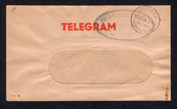 SOLOMON ISLANDS - 1959 - TELEGRAM: Window envelope with printed 'TELEGRAM' in red at top with oval 'POSTS & TELEGRAPHS DEPT HONIARA' cachet in black and HONIARA cds both on front.  (SOL/22393)