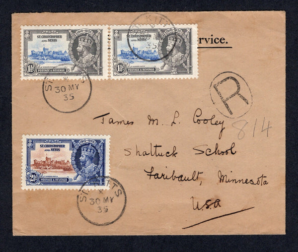 SAINT KITTS & NEVIS - 1935 - SILVER JUBILEE ISSUE & OFFICIAL MAIL: Registered headed 'On His Majesty's Service' official cover franked with 1935 pair 1½d ultramarine & grey and 2½d brown & deep blue GV 'Silver Jubilee' issue (SG 62/63) tied by ST. KITTS cds's with large 'R' in oval registration marking alongside. Addressed to USA with transit & arrival marks on reverse.  (STK/26269)