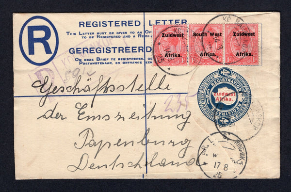 SOUTH WEST AFRICA - 1925 - POSTAL STATIONERY & REGISTRATION: 4d blue GV postal stationery registered envelope of South Africa with 'Zuidwest Afrika' overprint in red (H&G C8) used with added strip of three 1923 1d rose red 'GV Head' issue with 'ZUIDWEST AFRIKA' overprint, setting VI (SG 30) tied by KOLMANNSKOP 'German' type cds's with boxed 'KOLMANKOP' registration marking in violet alongside. Addressed to GERMANY with R.L.S. WINDHUK 'German' style transit cds on front and arrival cds on reverse. Scarce.  