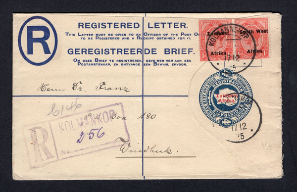 SOUTH WEST AFRICA - 1925 - POSTAL STATIONERY & REGISTRATION: 4d blue GV postal stationery registered envelope of South Africa with 'Zuidwest Afrika' overprint in red (H&G C8) used with added pair 1923 1d rose red 'GV Head' issue with 'ZUIDWEST AFRIKA' overprint, setting VI (SG 30) tied by KOLMANNSKOP 'German' type cds's dated 17 12 1925 with boxed 'KOLMANKOP' registration marking in violet alongside. Addressed to WINDHOEK with 'German' style arrival cds on reverse. Scarce.  (SWA/40898)