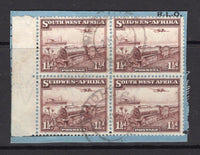 SOUTH WEST AFRICA - 1937 - TRAIN ISSUE: 1½d purple brown 'Mail Train' issue a fine side marginal block of four (comprising two se-tenant pairs) tied on piece by light WINDHOEK cds's. (SG 96)  (SWA/5524)