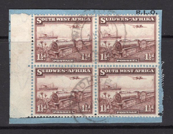 SOUTH WEST AFRICA - 1937 - TRAIN ISSUE: 1½d purple brown 'Mail Train' issue a fine side marginal block of four (comprising two se-tenant pairs) tied on piece by light WINDHOEK cds's. (SG 96)  (SWA/5524)