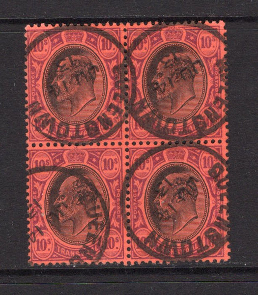 TRANSVAAL - 1913 - MULTIPLE & INTERPROVINCIAL USE: 10/- black & purple on red EVII issue, a superb used block of four with four strikes of QUEENSTOWN cds dated JUN 14 1913 used in the Cape of Good Hope during the inter-provincial period. (SG 271)  (TRA/13559)