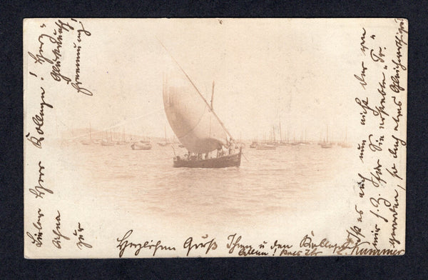 URUGUAY - 1902 - POSTAL STATIONERY: 2c blue on pale blue postal stationery card (H&G 45) with privately printed view in sepia on reverse showing a yacht in Montevideo harbour used with added 1900 1c green (SG 230) tied by MONTEVIDEO cds dated 14 JUN 1902. Addressed to GERMANY with arrival cds on front. Rare.  (URU/40642)