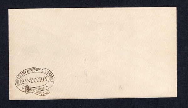 URUGUAY - 1880 - OFFICIAL STATIONERY: Plain white envelope made of laid paper with oval 'DIRECCION Y ADMON GRAL DE CORREOS 2A SECCION MONTEVIDEO' official 'Belt Buckle' handstamp in black in bottom left hand corner. Produced as official stationery for use by the Postal department. Unused.  (URU/40647)