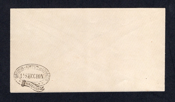 URUGUAY - 1880 - OFFICIAL STATIONERY: Plain white envelope made of laid paper with oval 'DIRECCION Y ADMON GRAL DE CORREOS 1A SECCION MONTEVIDEO' official 'Belt Buckle' handstamp in black in bottom left hand corner. Produced as official stationery for use by the Postal department. Unused.  (URU/40648)