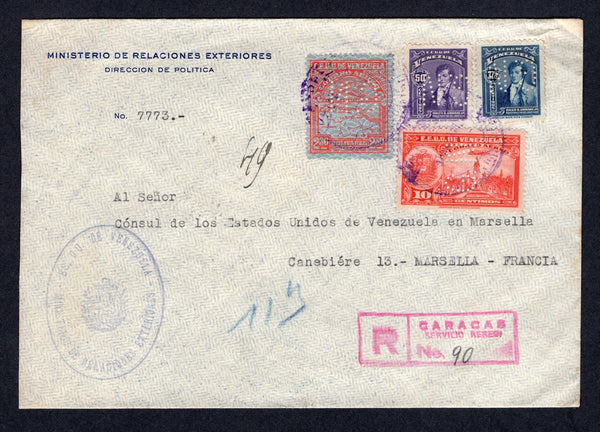 VENEZUELA - 1941 - OFFICIAL MAIL: Printed 'Ministerio de Relaciones Exteriores Direccion de Politica' registered cover franked with 1932 2b 30c scarlet, 1938 10c carmine and 1940 37½c blue and 50c violet (SG 441, 519, 604 & 606) all with official 'G.N.' PERFINS tied by CARACAS cds's in violet with boxed 'CARACAS SERVICIO AEREO' registration marking in red alongside with large oval official cachet. Addressed to FRANCE with transit & arrival marks on reverse.  (VEN/39228)
